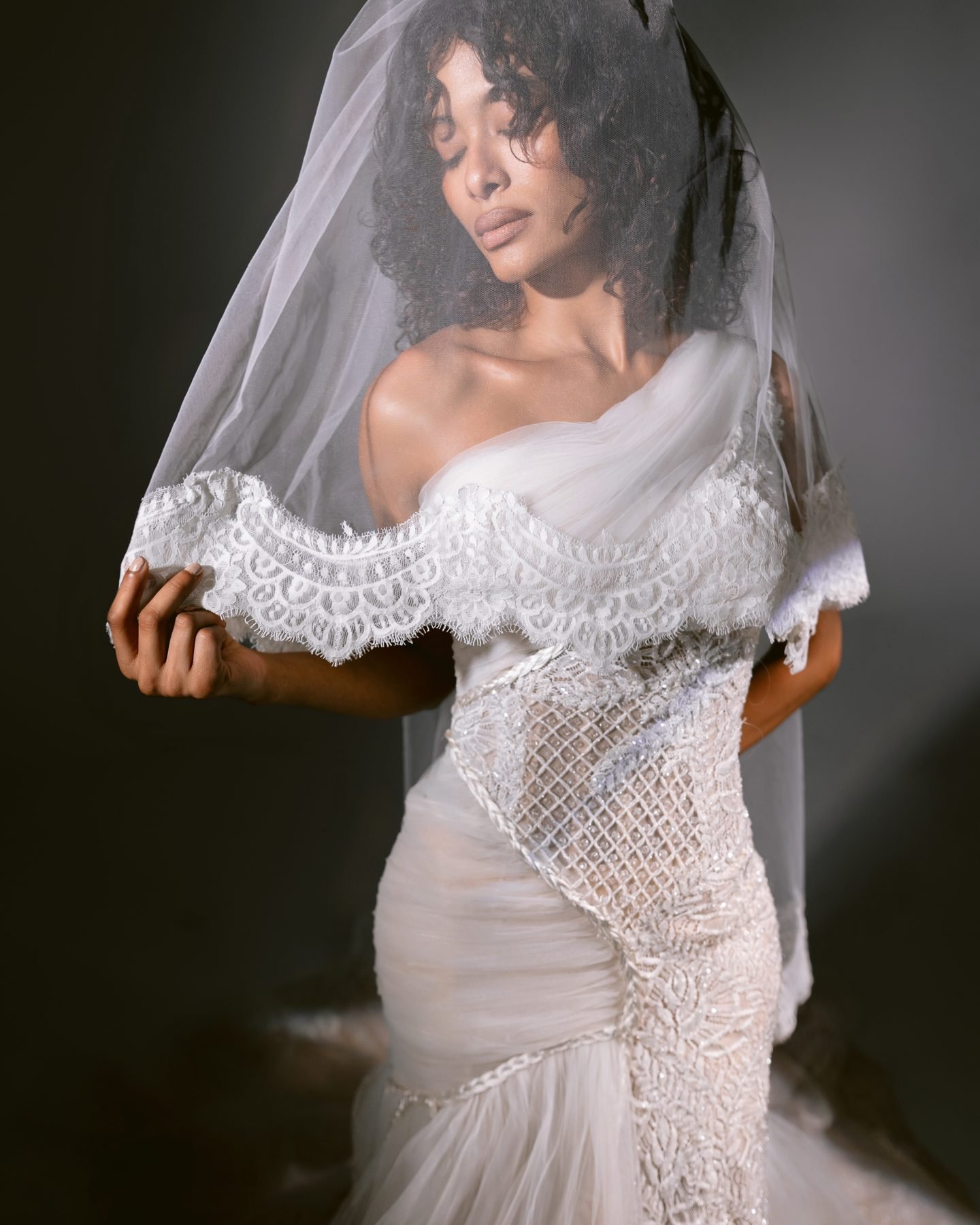 Bride under a lace-edged veil