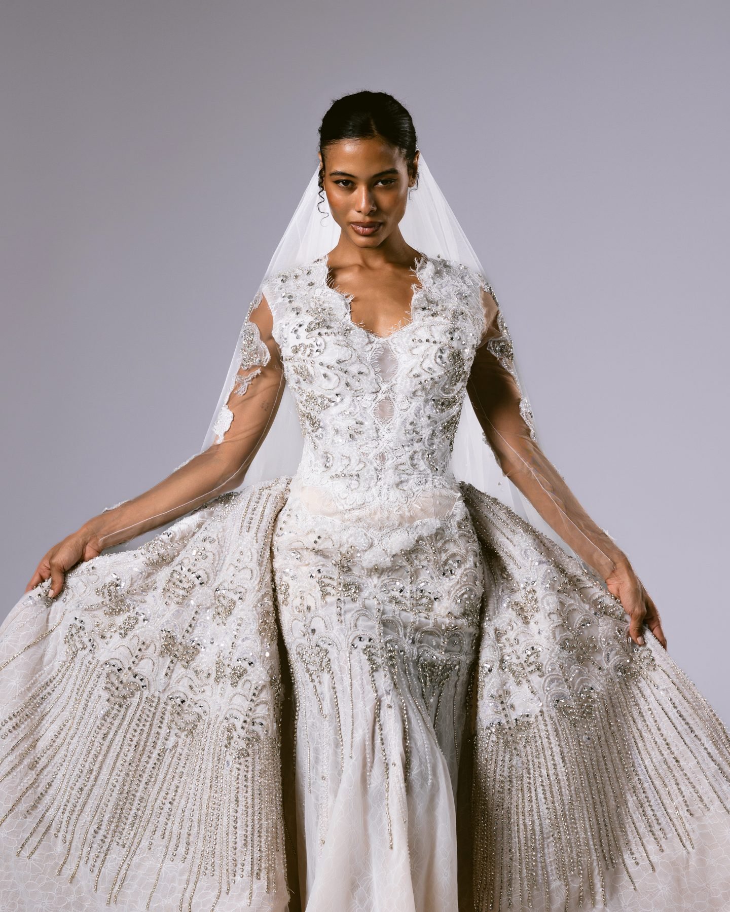 Embellished gown with wide skirt and veil